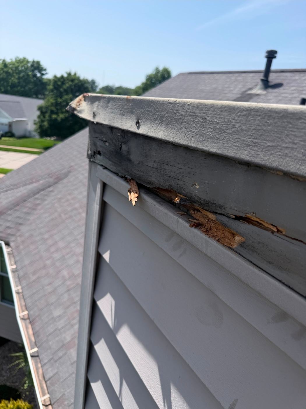 Chimney chase cover that does not overhang the chase, with the wood framing rotted through at the corner
