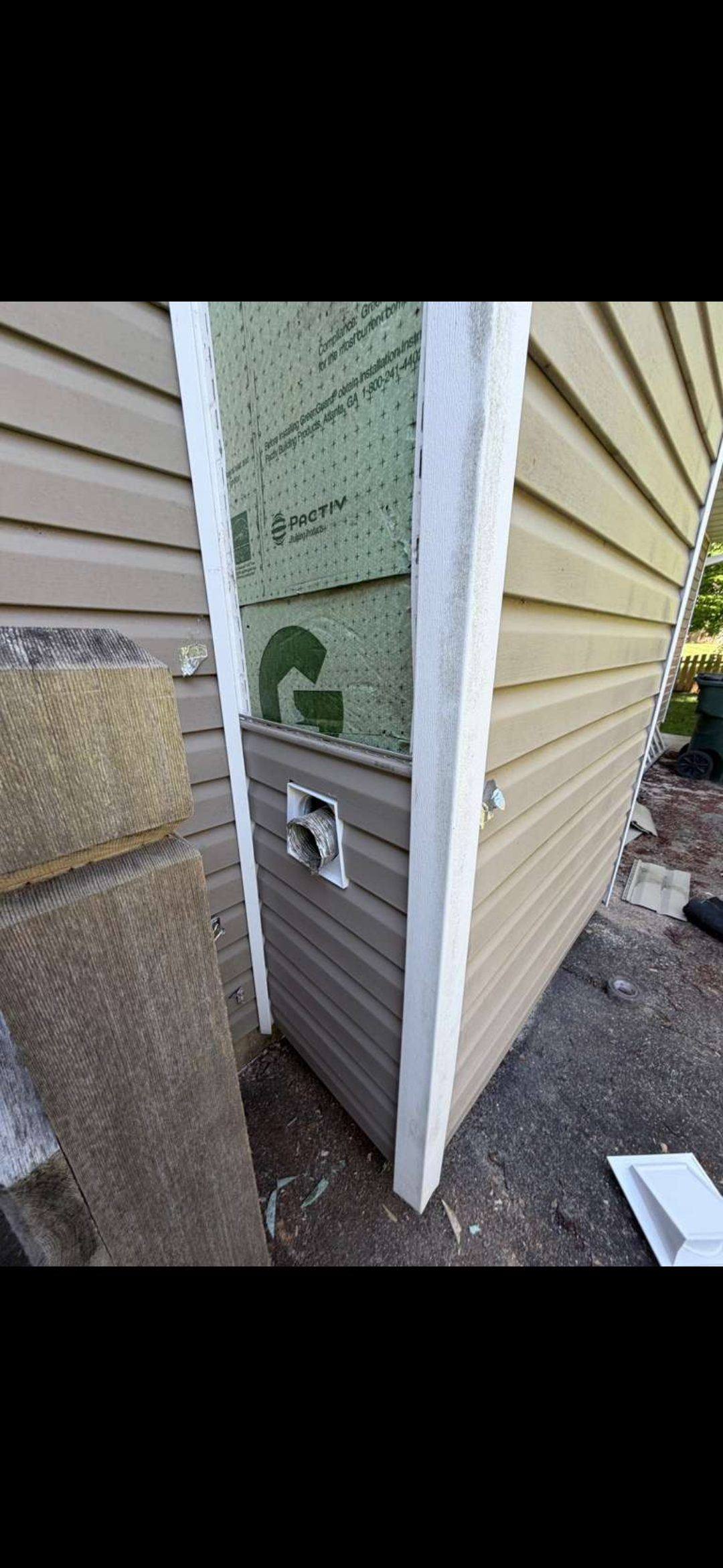 New siding being fitted to a repaired chimney chase in O'Fallon MO