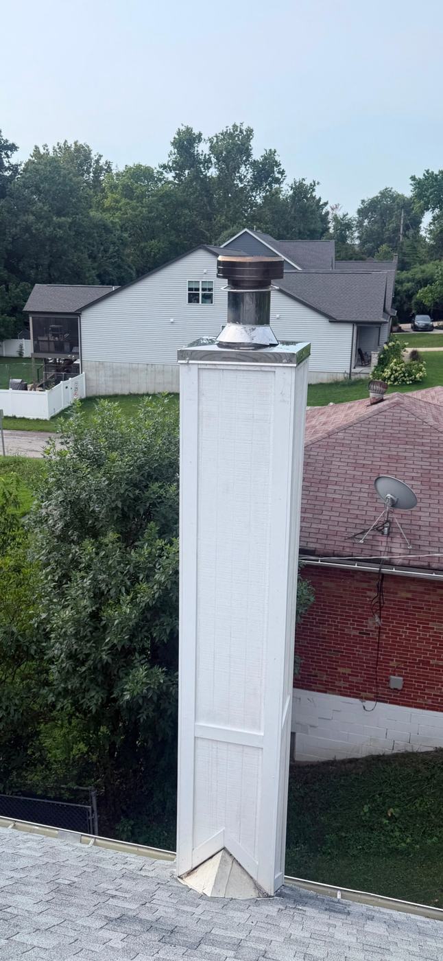 Finished chimney chase with new siding, trim, chase cover and cap, every joint closed against water, St. Louis MO