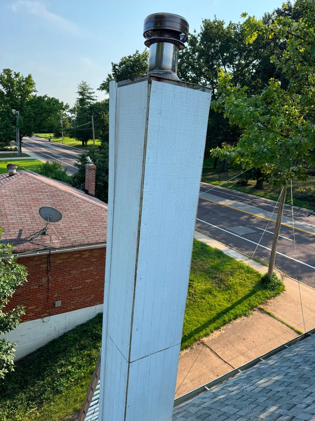 Rotted chase sheathing replaced and the whole chimney chase re-wrapped square and dry before new siding goes on
