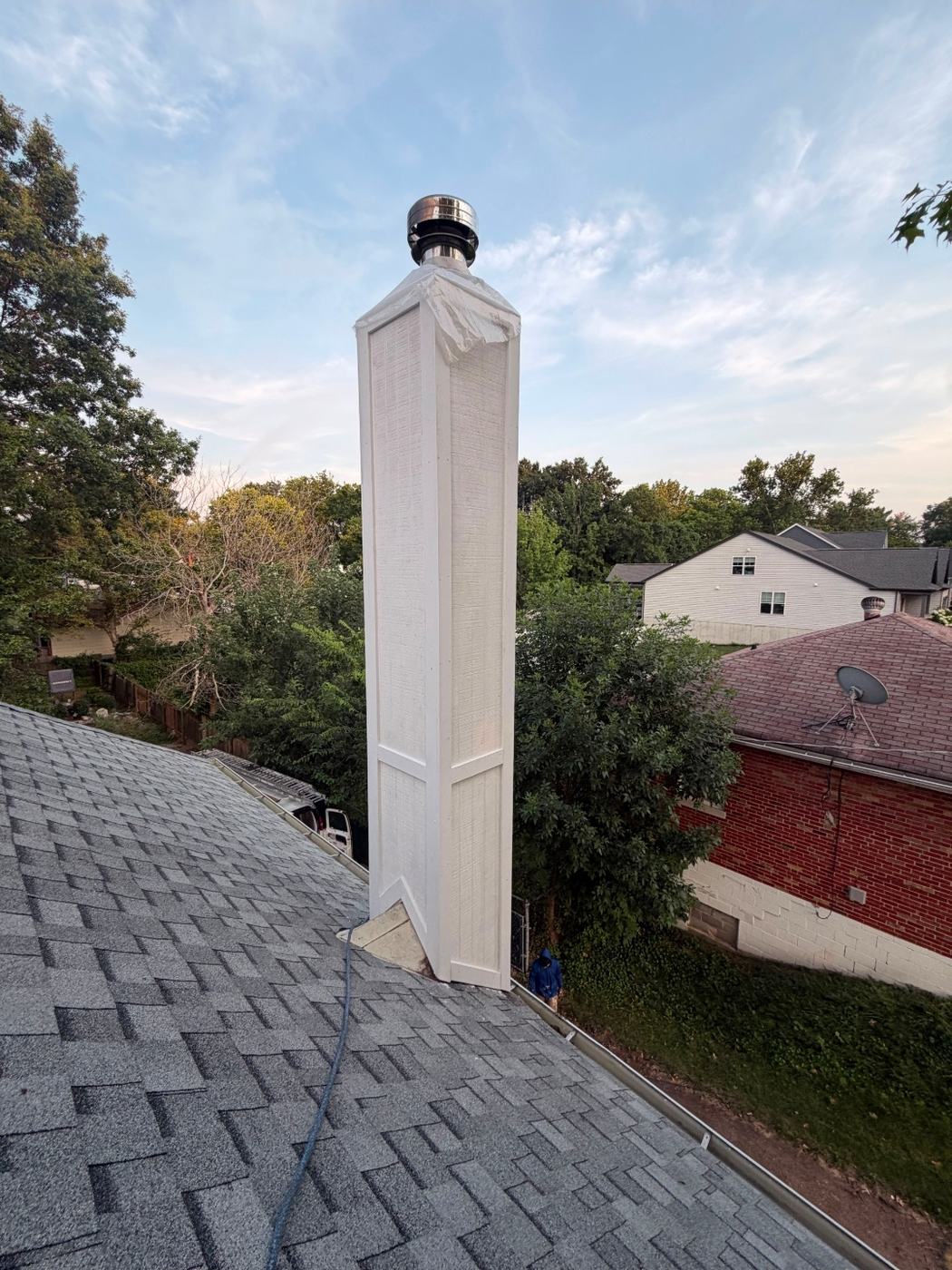 New chase siding and trim complete up the full height of the chimney chase, St. Louis MO