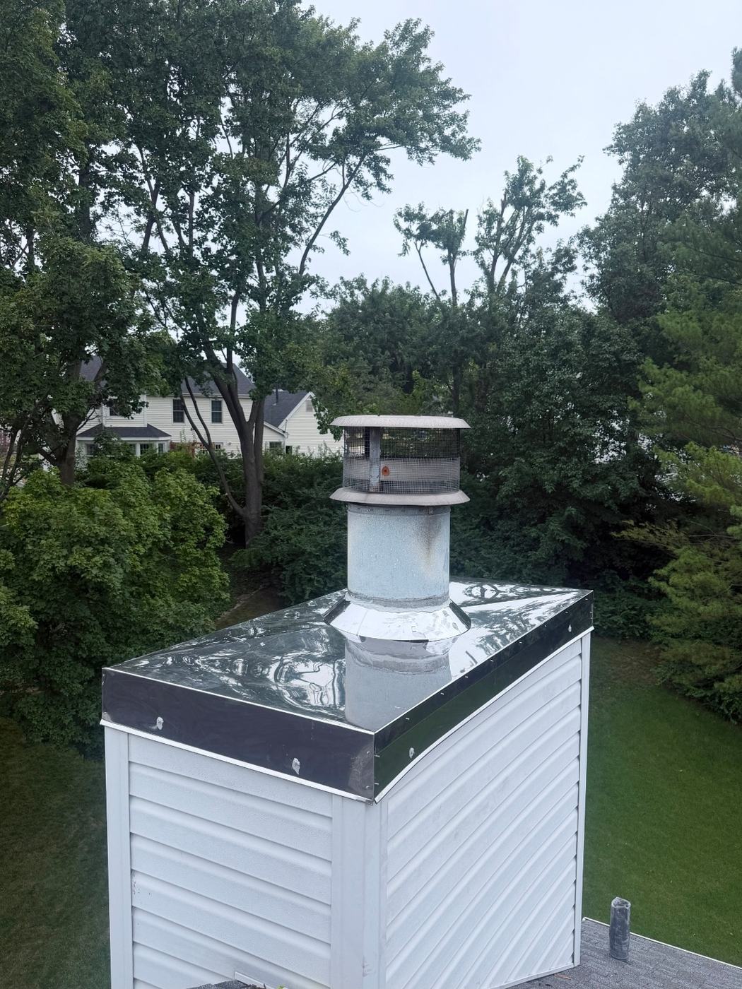 New stainless steel chase cover with a cross break and a new chimney cap, St. Louis MO