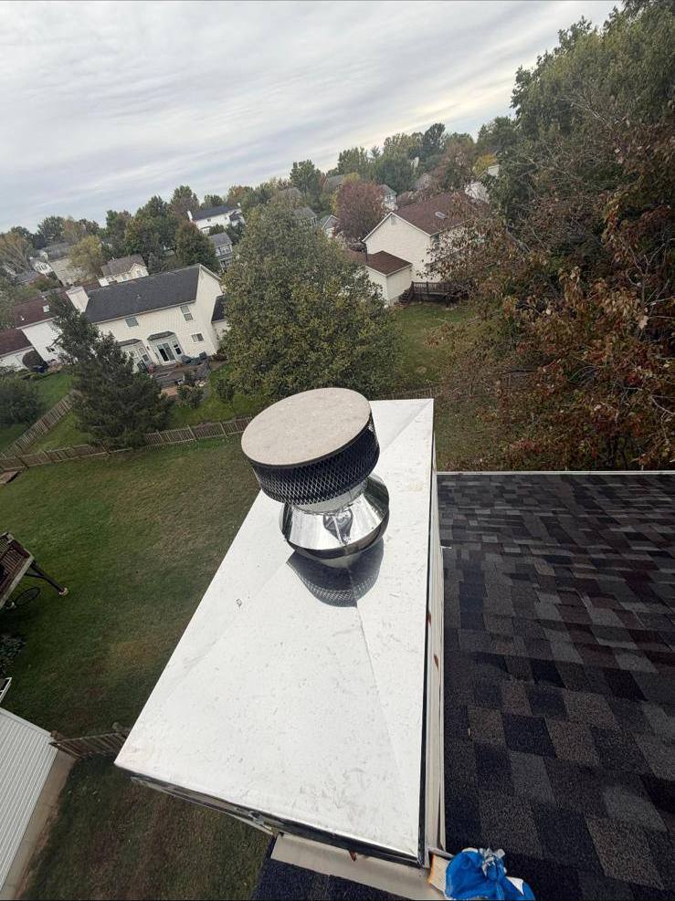 New stainless chimney cap installed on a chase cover in St. Louis, MO