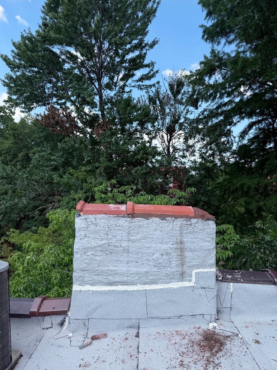 Full chimney after the clay coping tile replacement, parged and re-crowned, St. Louis MO