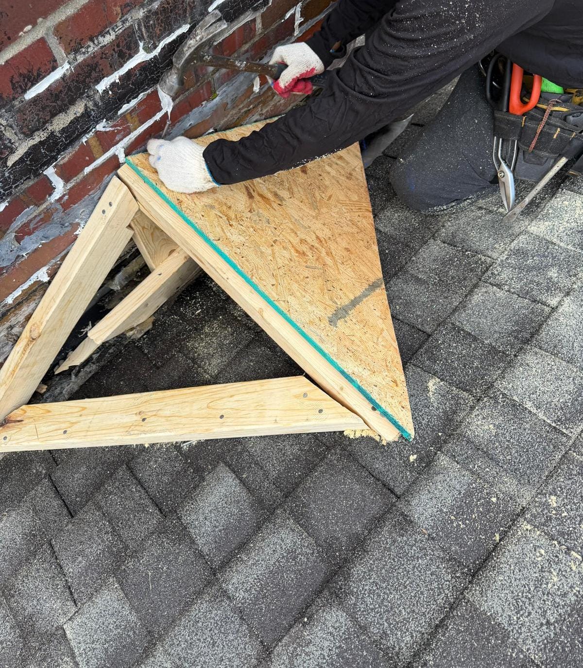 Cricket frame being built behind chimney