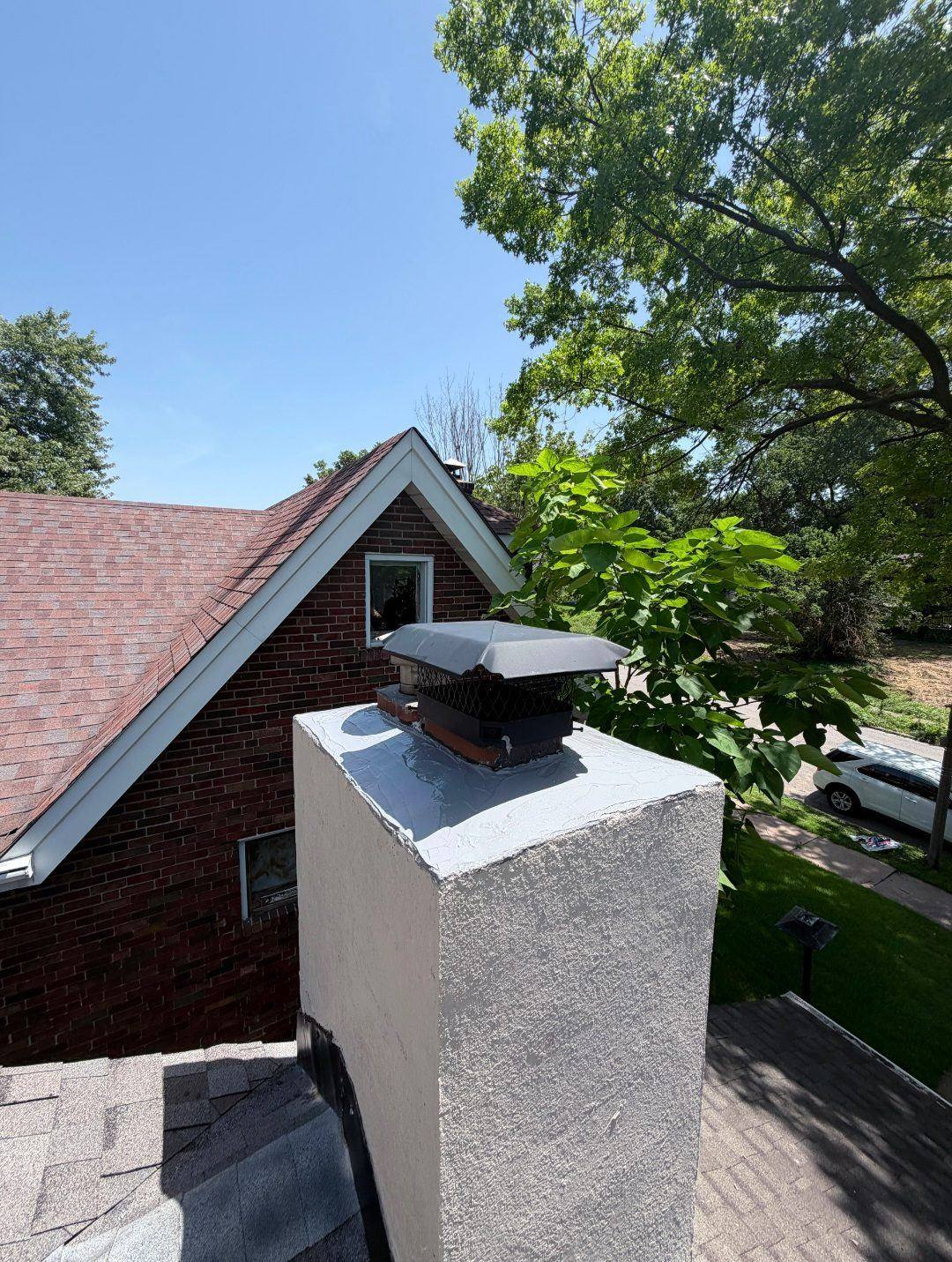 Finished chimney saddle diverting water around the chimney