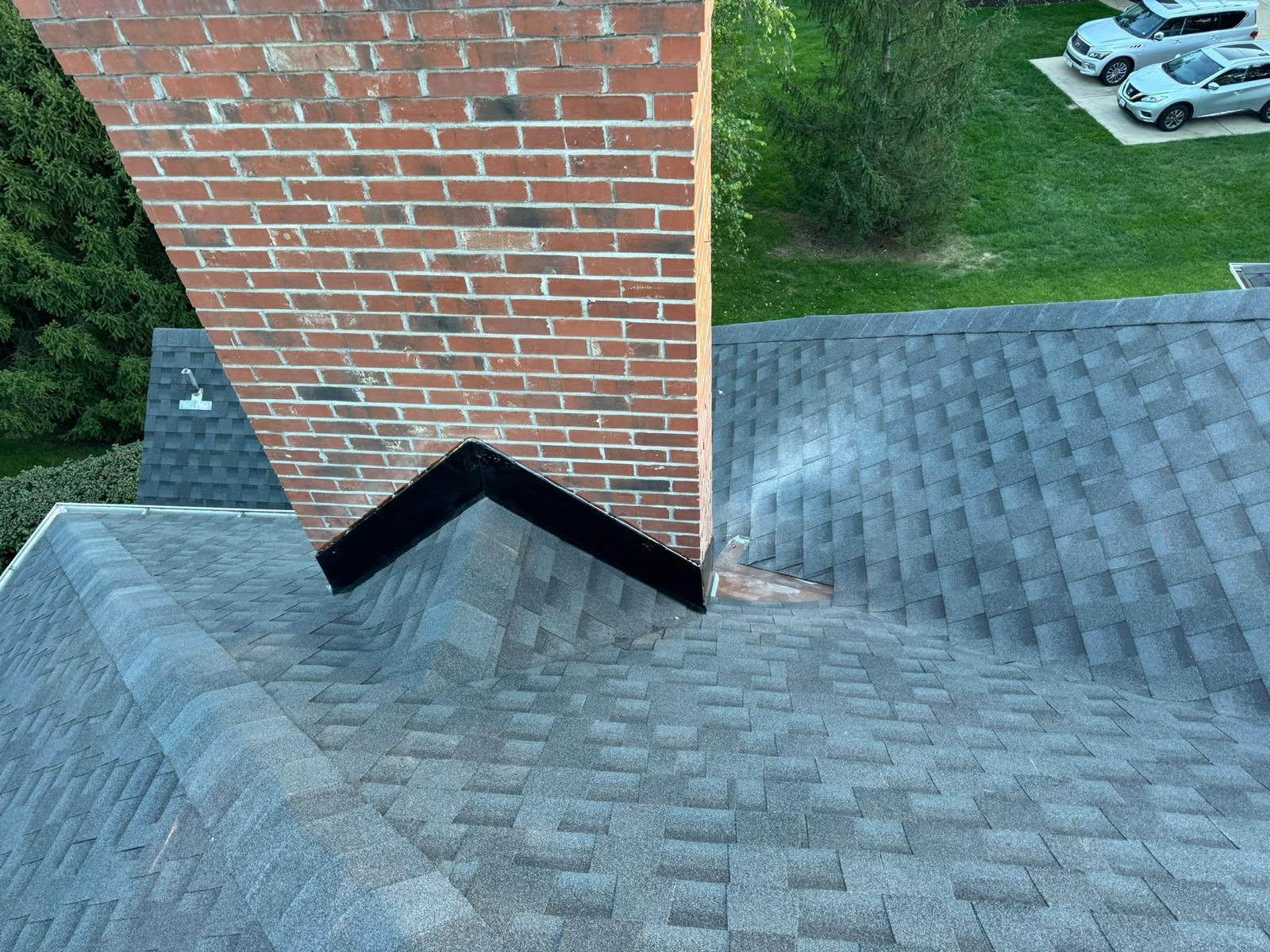 Chimney flashing repair completed — new metal flashing installed