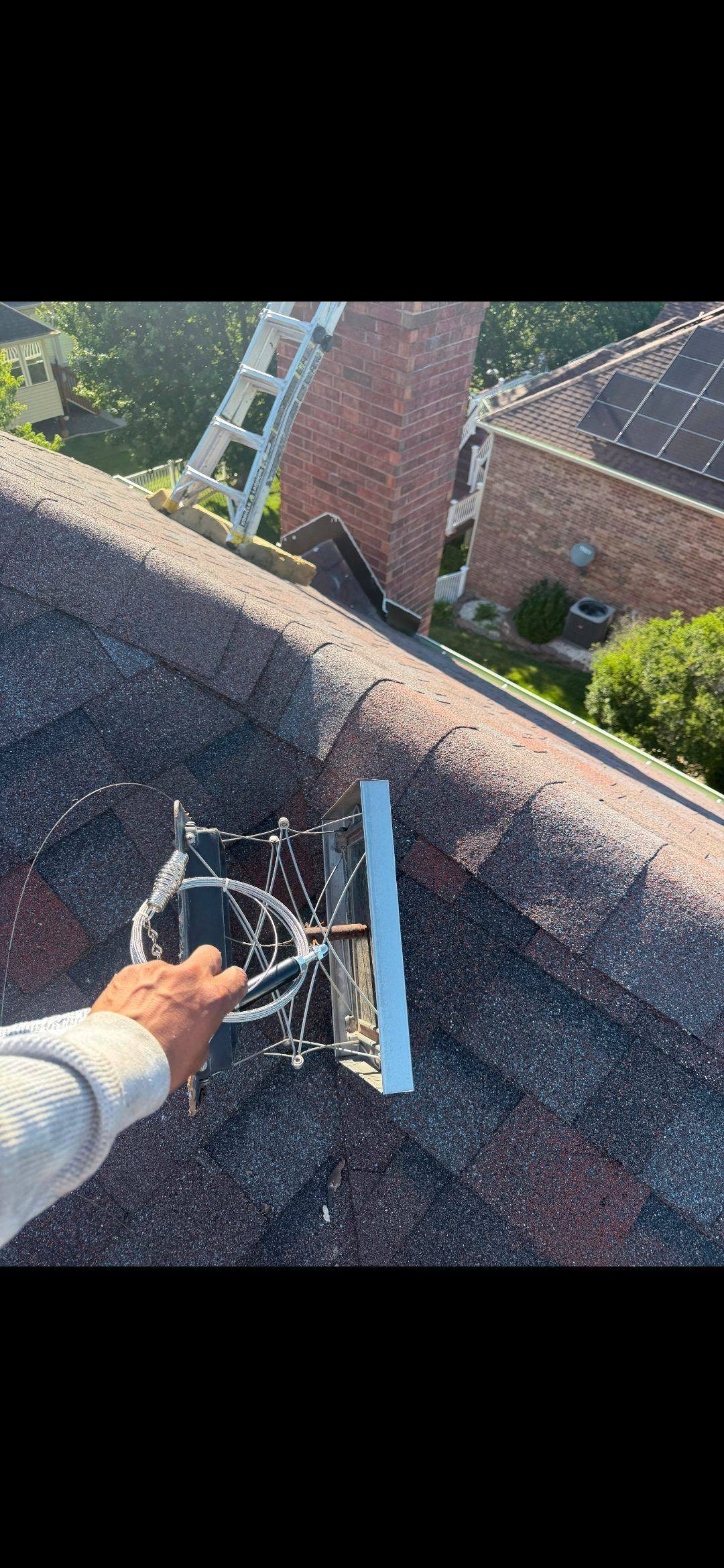 Finished chimney leak repair including replaced ridge shingle