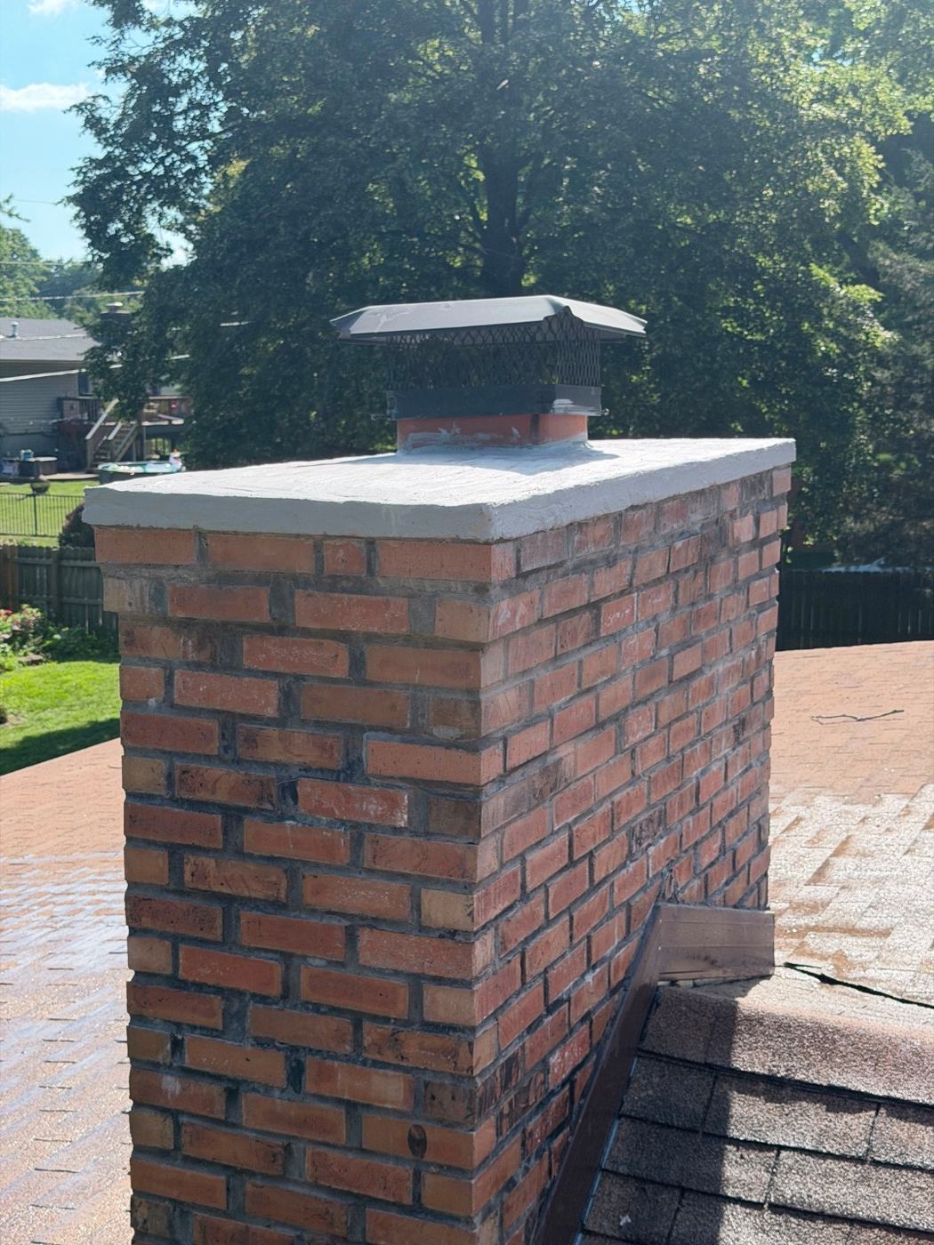 Close-up of the rebuilt chimney corner that had the hidden void, laid solid and tooled to match the original brick