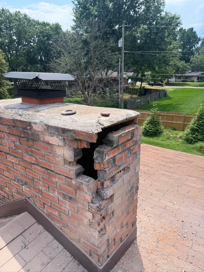 Failed chimney brick removed, exposing a void that ran right through the corner of the chimney behind the old patch