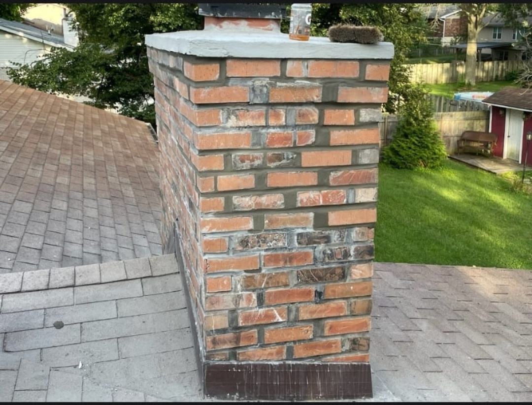 Chimney tuckpointing complete with every open joint ground out, repacked and tooled in colour-matched mortar, St. Louis MO