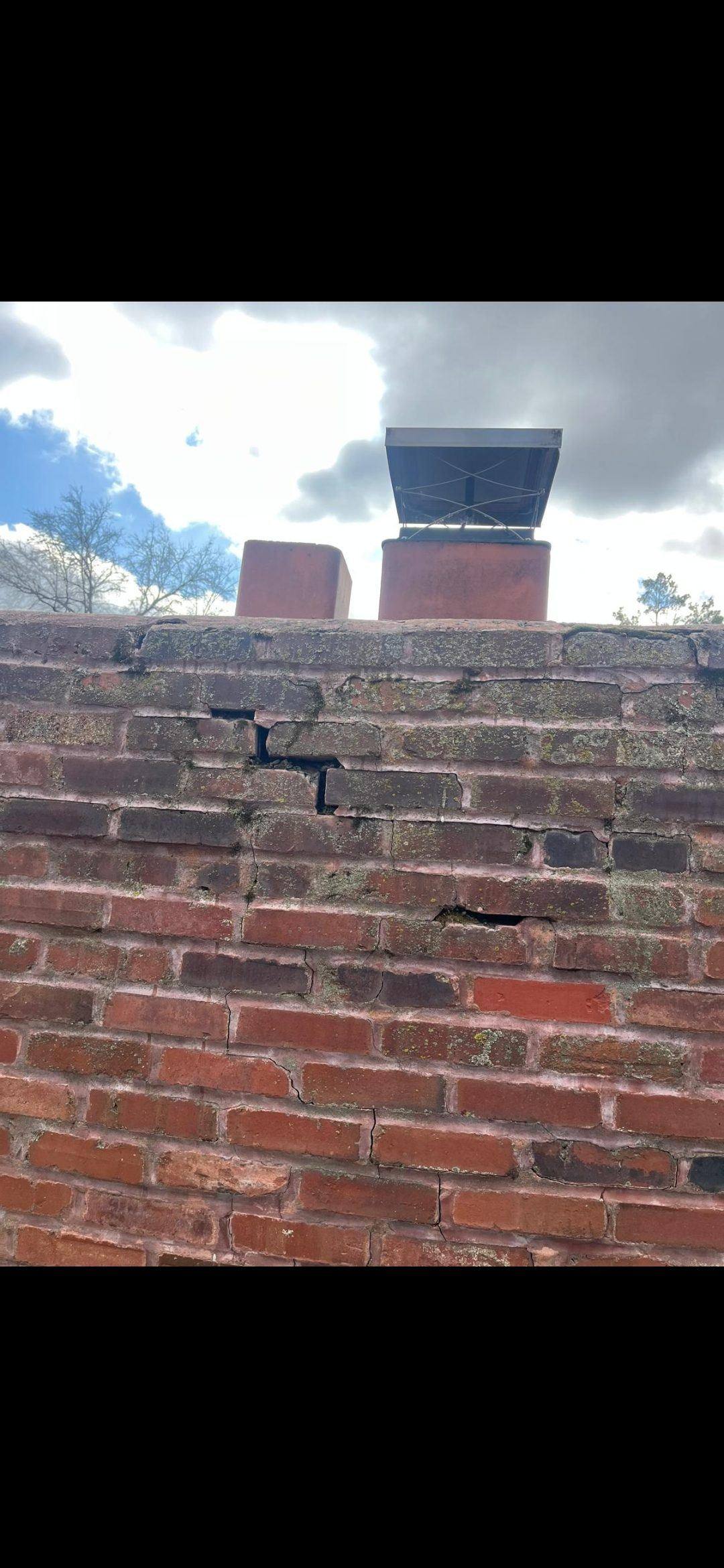 Failing mortar joints on a Chesterfield chimney before restoration