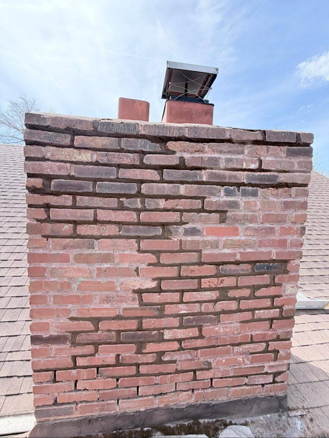 Tuckpointing and liner installation during a full chimney restoration