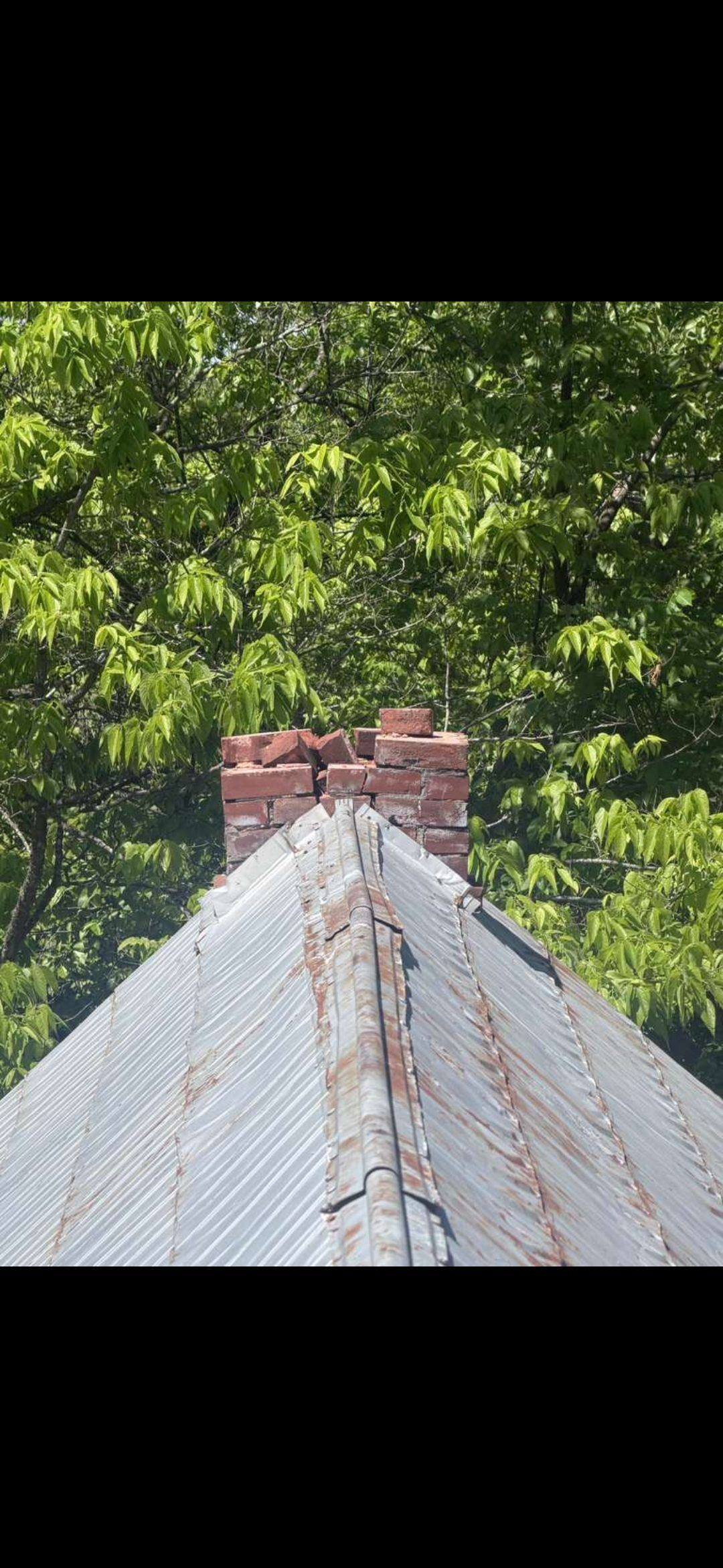 Deteriorated chimney above the roofline before rebuild