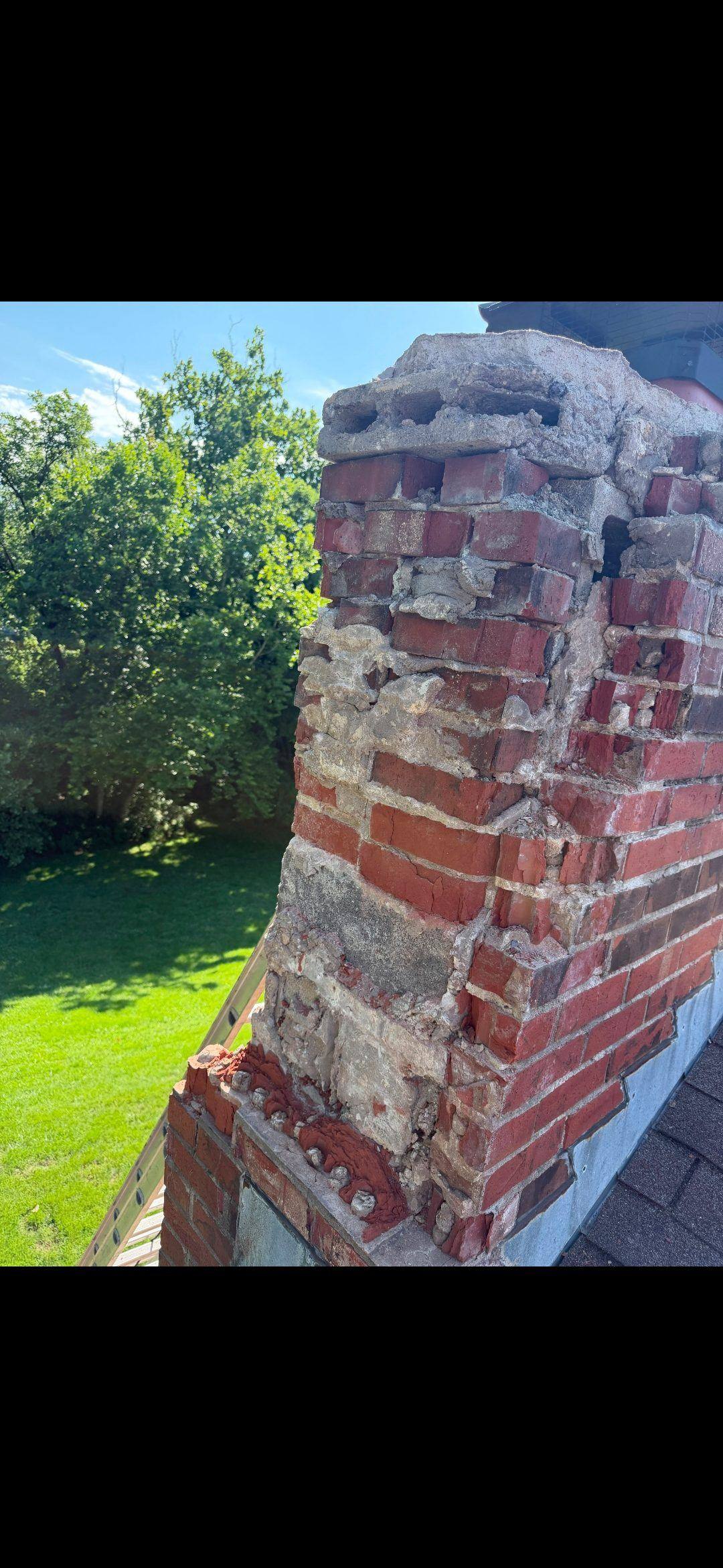 Demolishing the failed above-roofline section