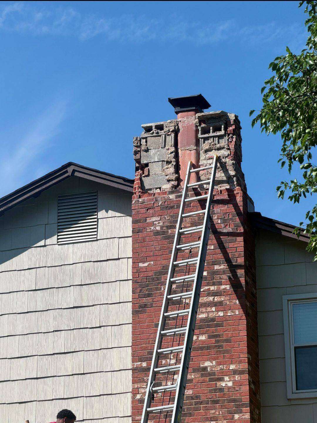 Removing cracked brick courses from a chimney