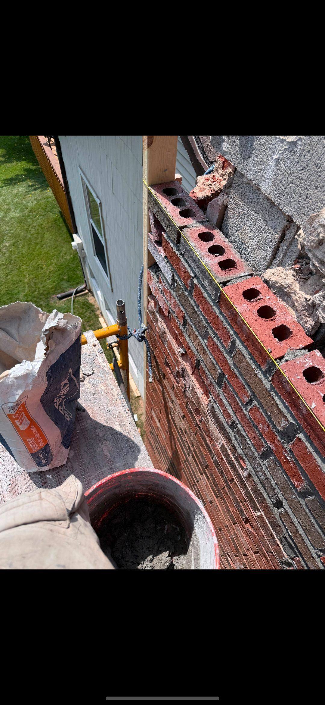 New flue tile set during an above-roofline rebuild