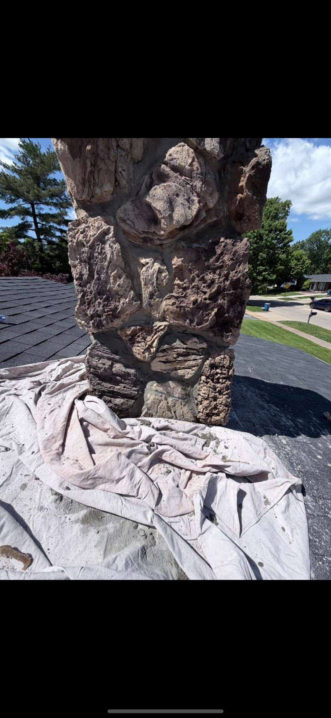 Hand-tooled mortar joints on a repointed fieldstone chimney