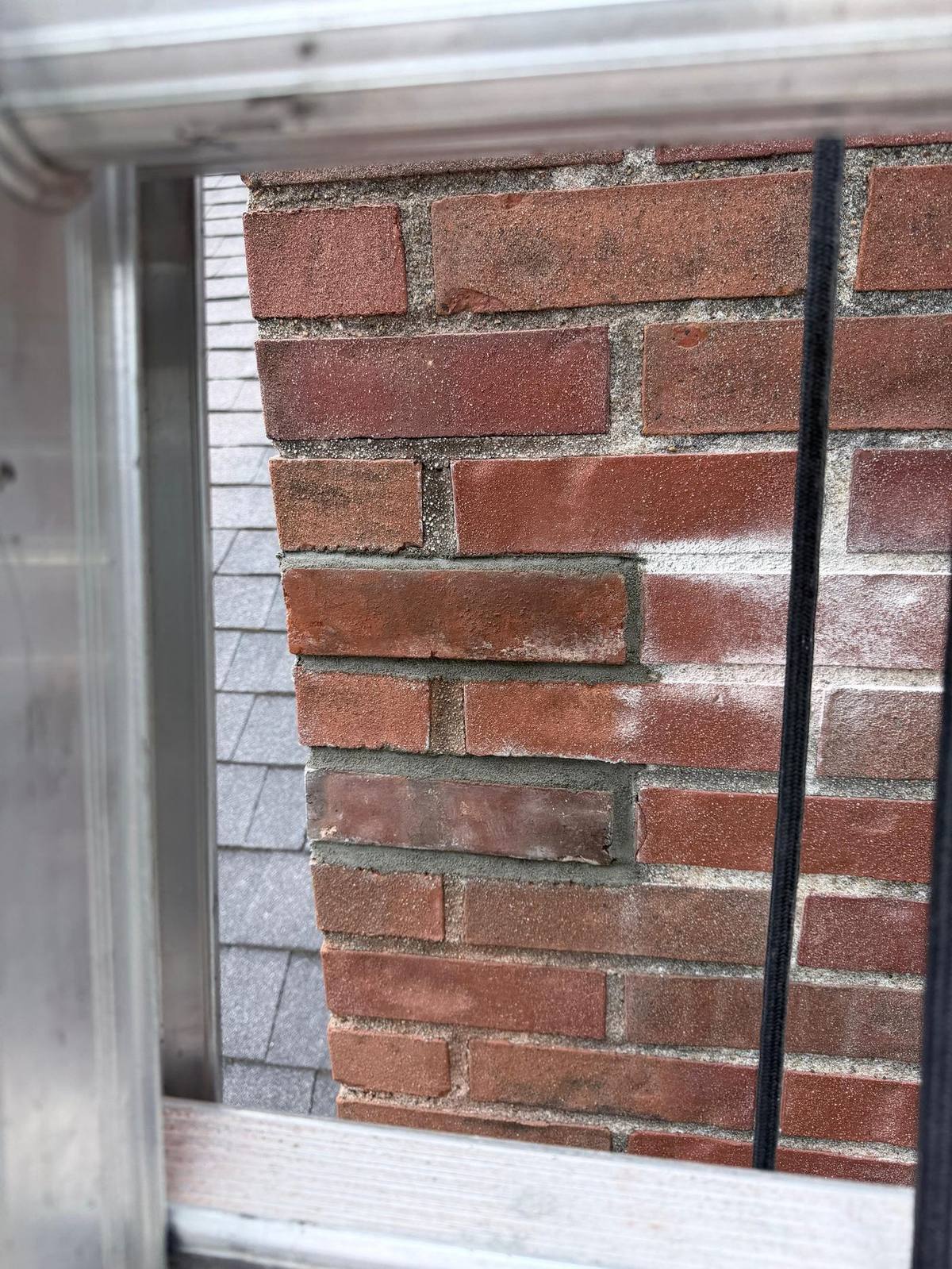 Finished tuckpointed chimney with color-matched joints, University City