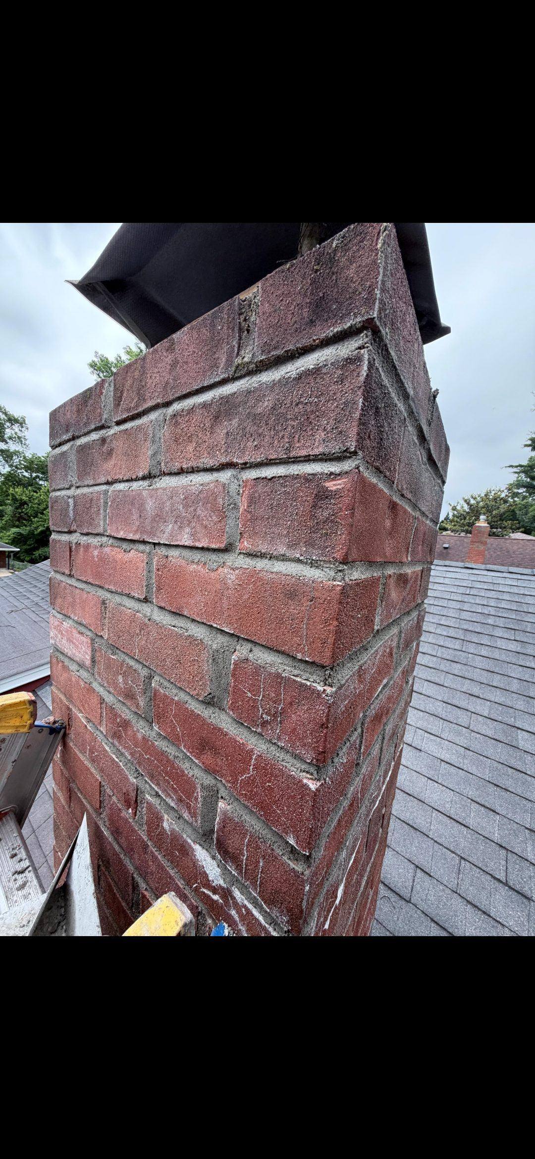 Completed chimney tuckpointing — side view of finished work