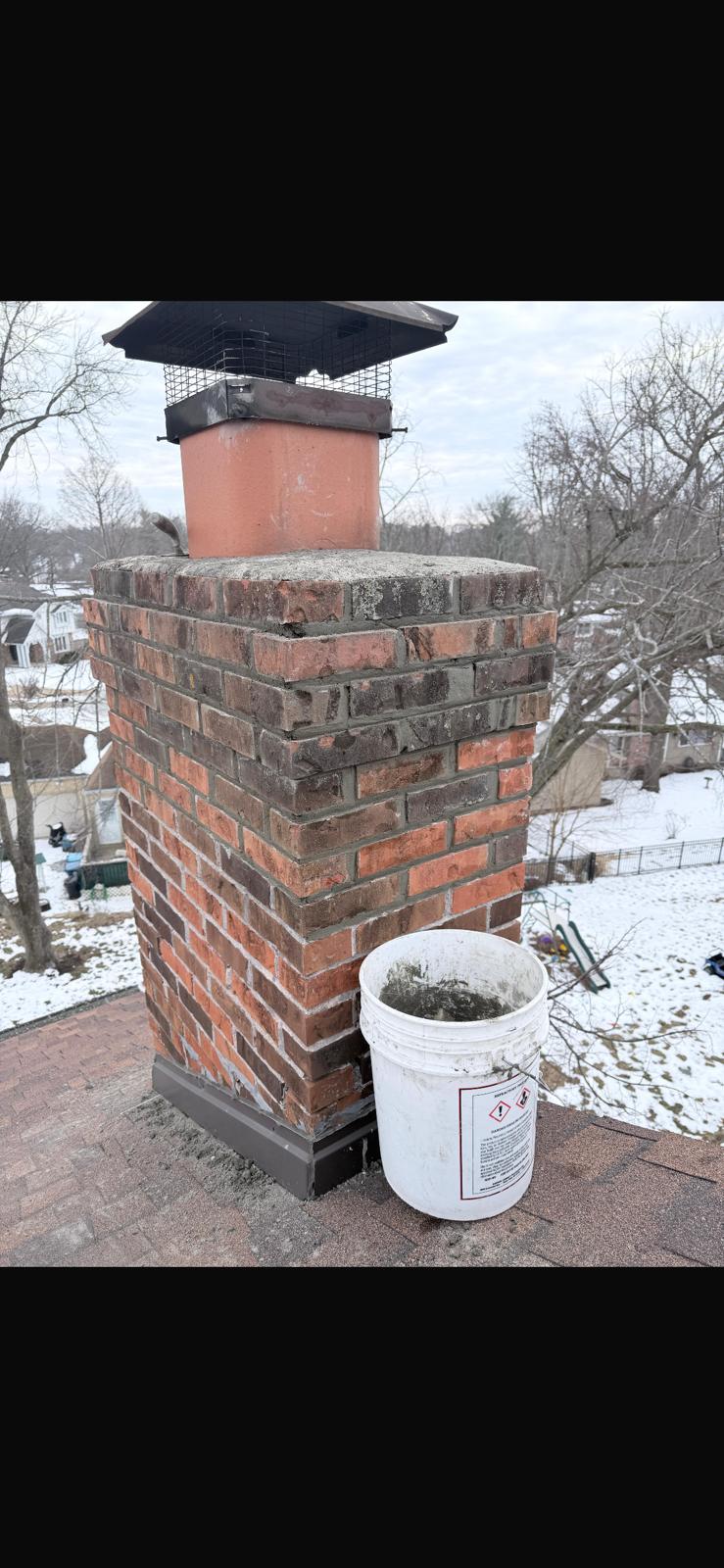 Chimney completed tuckpointing with clean color-matched mortar joints