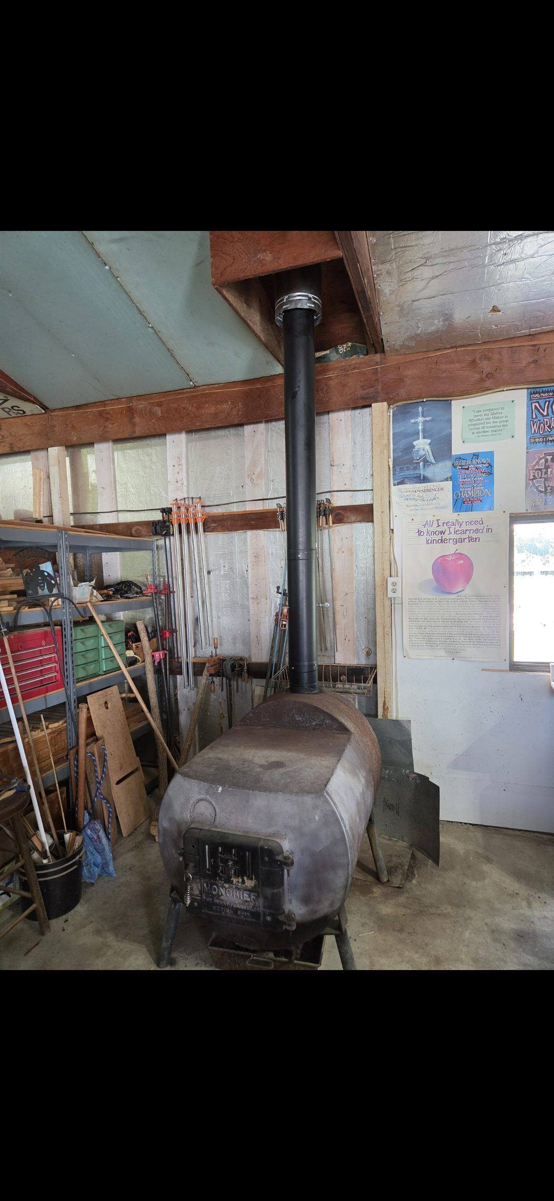 Spark arrestor cap on a code-compliant wood stove chimney